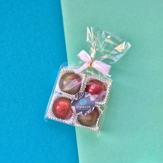 4er Pralinenblister mit Kalamansi-Karamell und Mango-Himbeere