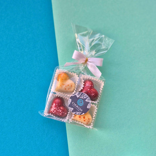 4er Pralinenblister Sesamnougat und Cassisnougat in Herzform